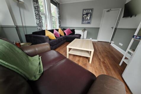 A cozy and inviting living room featuring comfo...