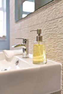 Close-up of a modern sink with chrome faucet an...