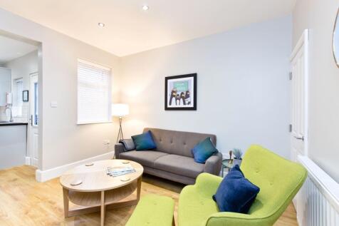 Bright and inviting living room featuring a con...