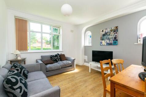 Bright and welcoming living room with large win...