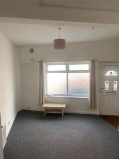 A bright and airy living room featuring a large...