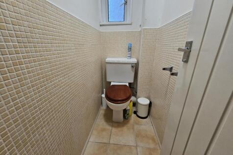 A clean and well-maintained bathroom with a toi...