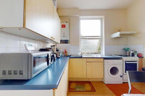 A bright and functional kitchen featuring a blu...