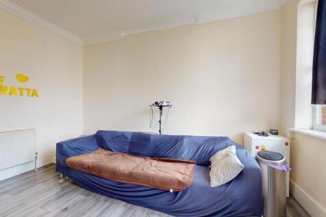 A cozy living space featuring a sofa, window wi...