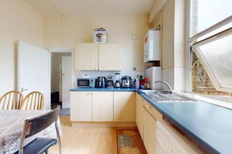 Bright and inviting kitchen featuring a large w...