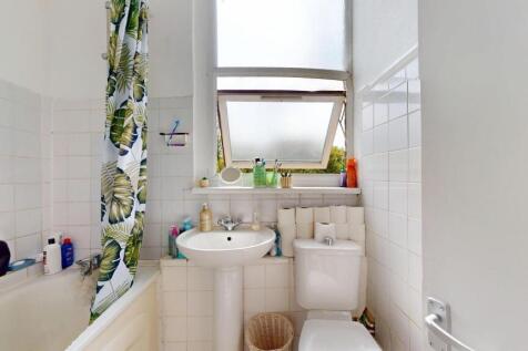 Bright and functional bathroom featuring a bath...