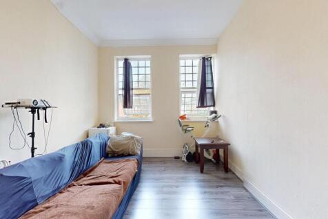 Bright and straightforward living room with two...