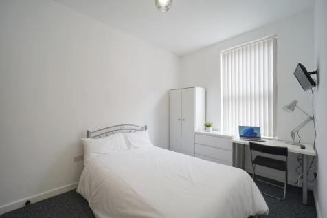 A neatly presented single bedroom featuring a c...
