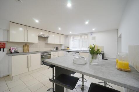 Bright and modern kitchen with ample natural li...