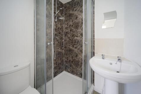 A clean and well-maintained bathroom featuring ...