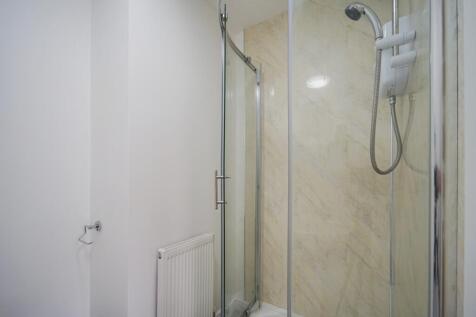 A clean, well-maintained bathroom featuring a s...