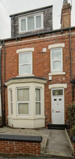 Exterior view of a charming brick house with a ...