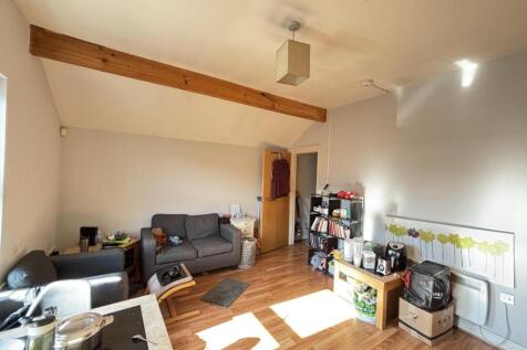 Bright and spacious living room with abundant n...