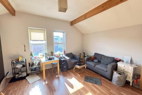 Bright and welcoming living room featuring comf...