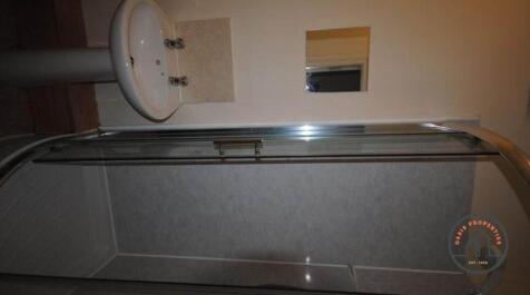 A bright and modern bathroom featuring a large ...