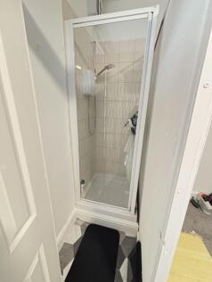 A clean, well-maintained small bathroom with a ...