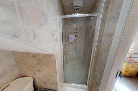 A clean and modern bathroom featuring a spaciou...