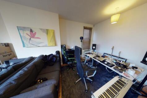 A contemporary living room featuring a large so...