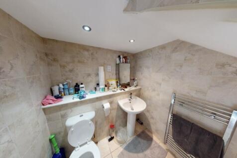 A functional bathroom with a bathtub, basic fix...