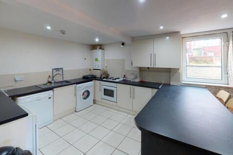 Bright and spacious kitchen featuring modern wh...