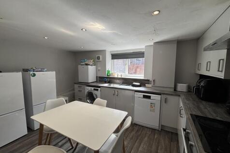 Bright and tidy kitchen with modern appliances,...