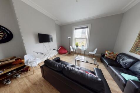 A modern and comfortable living room with ample...
