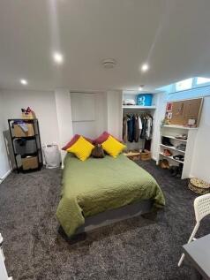 A well-organized double bedroom featuring a com...
