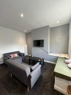 A contemporary living room featuring two comfor...