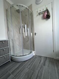 Clean and modern bathroom featuring a spacious ...