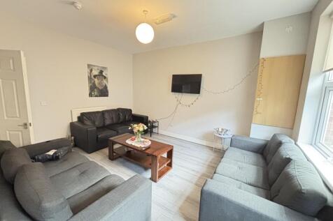 Bright and spacious living room featuring cozy ...