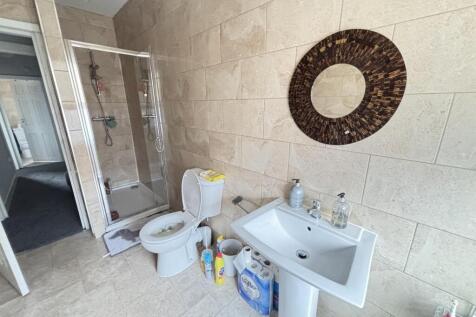 A well-maintained bathroom featuring a large sh...