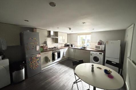 Bright and modern kitchen with ample natural li...