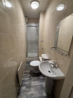 A compact and well-maintained bathroom with a s...
