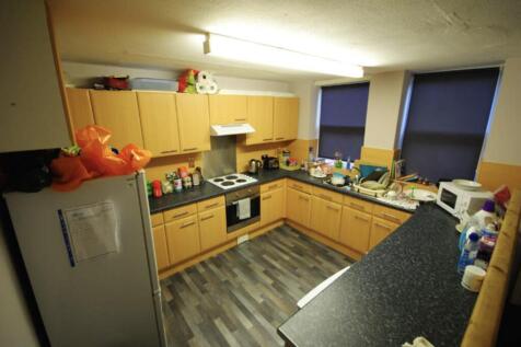 A well-lit kitchen with ample counter space and...