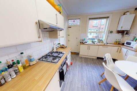 Bright and welcoming living room with ample nat...