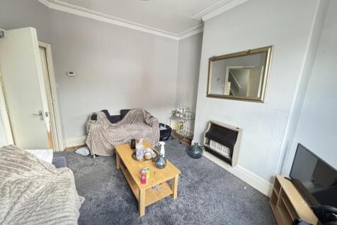 Cosy reception room with neutral décor, carpete...