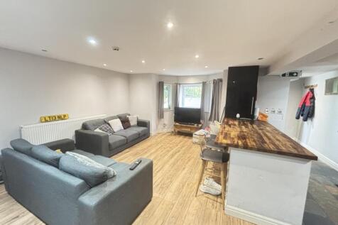 A spacious and modern living room with comforta...