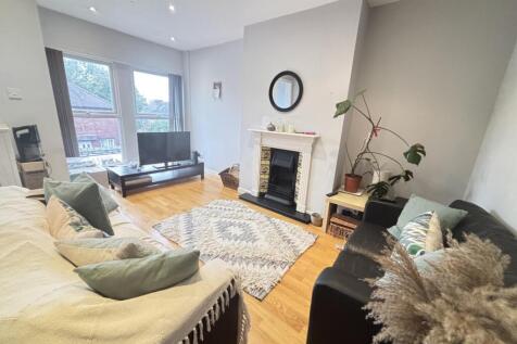 A spacious and inviting living room featuring l...