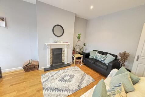 Bright and welcoming living room featuring mode...