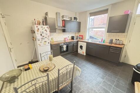 A well-lit, modern kitchen with ample counter s...