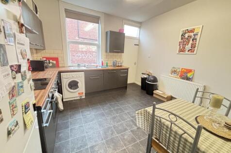 A bright and inviting living room with ample sp...