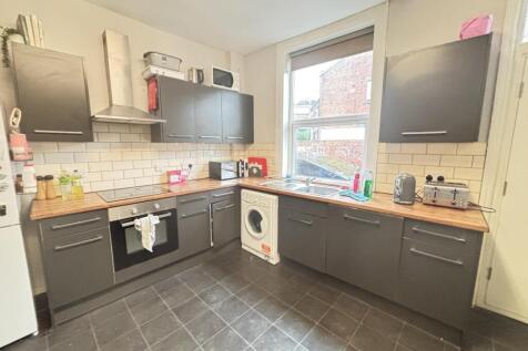 A modern kitchen with ample cabinetry and a lar...