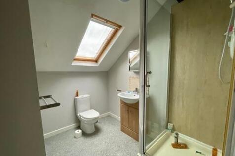 Bright and clean bathroom with natural light co...