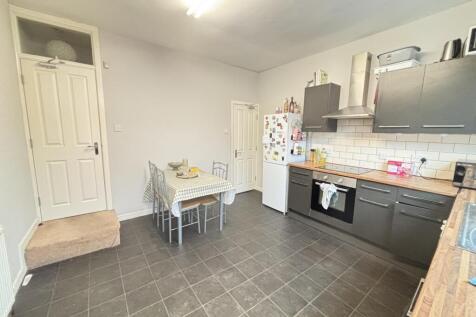 A bright and modern kitchen with ample counter ...