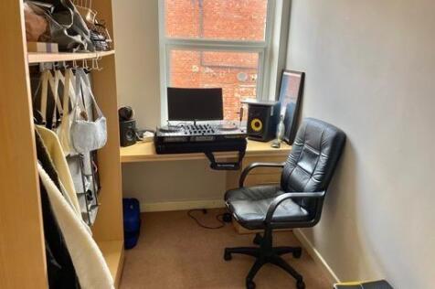 A functional student workspace featuring a desk...