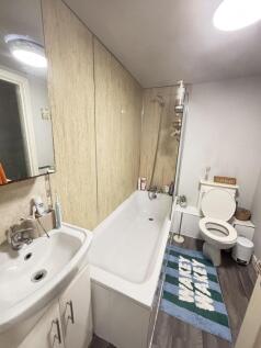 A clean and functional bathroom featuring a bat...