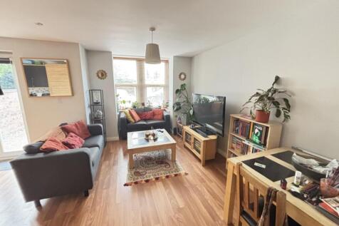 Bright and welcoming living room featuring comf...