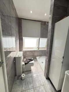 A modern, well-maintained bathroom featuring a ...
