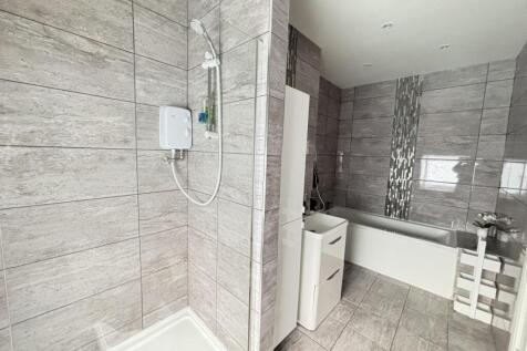 A modern, well-maintained bathroom featuring a ...