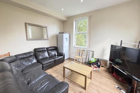 Spacious and well-lit living room featuring mod...